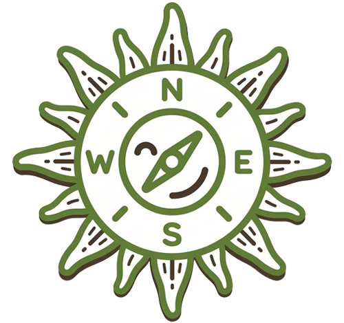 Green and white graphic icon of a compass designed to look like a sun with N, E, S, W directional markers.